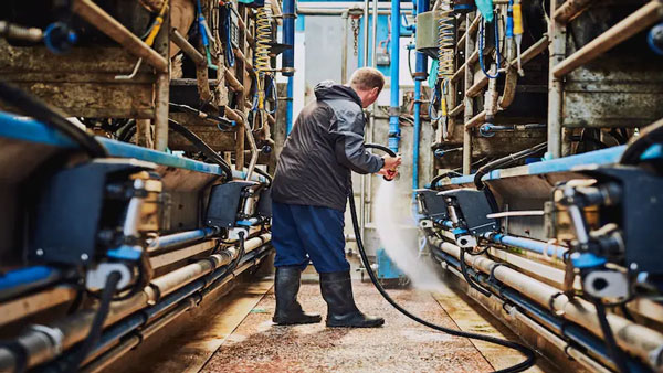 Man cleaning in industrial area