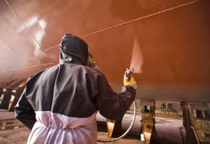 technician painting a ship in Georgia