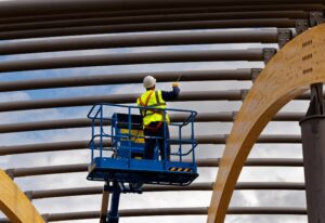 An industrial painter painting steelwork in Charlotte, NC.